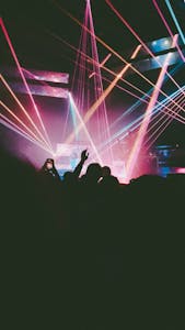 Dynamic concert scene with neon lights and crowd in Antwerpen, Belgium.