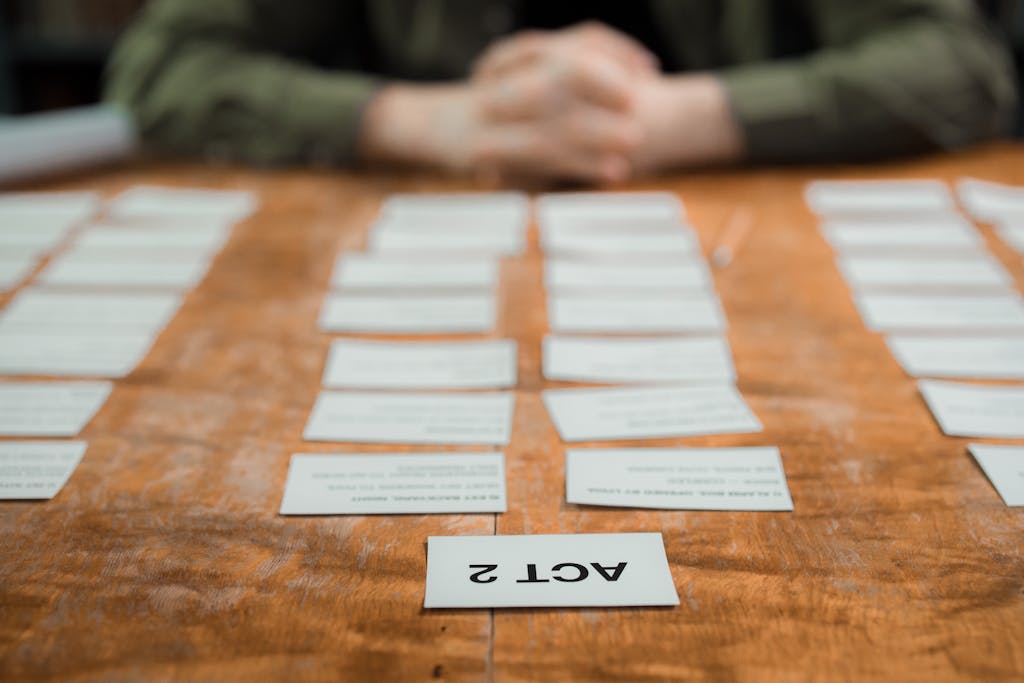 Close-up of storyboard cards arranged on a table for scriptwriting planning. A find way to encourage immersive learning..